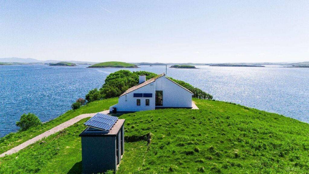 The two-bedroom house runs on solar power backed by a generator, while rainwater is stored in underground tanks.