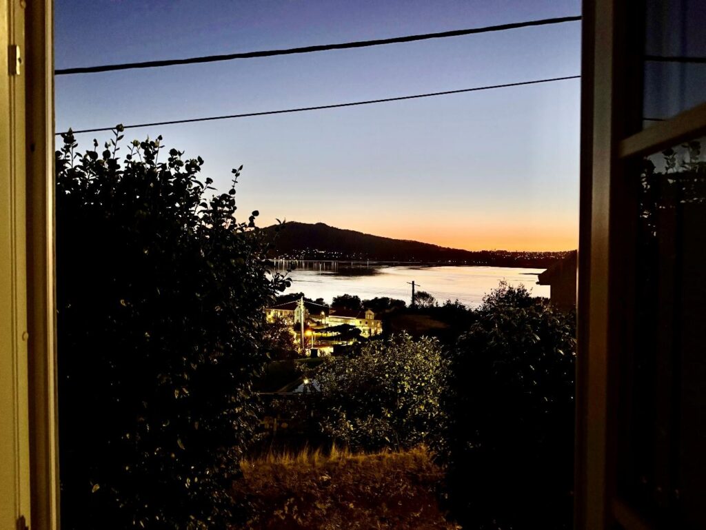 As the sun sets, I like to sit and read in my living room with the windows open.
